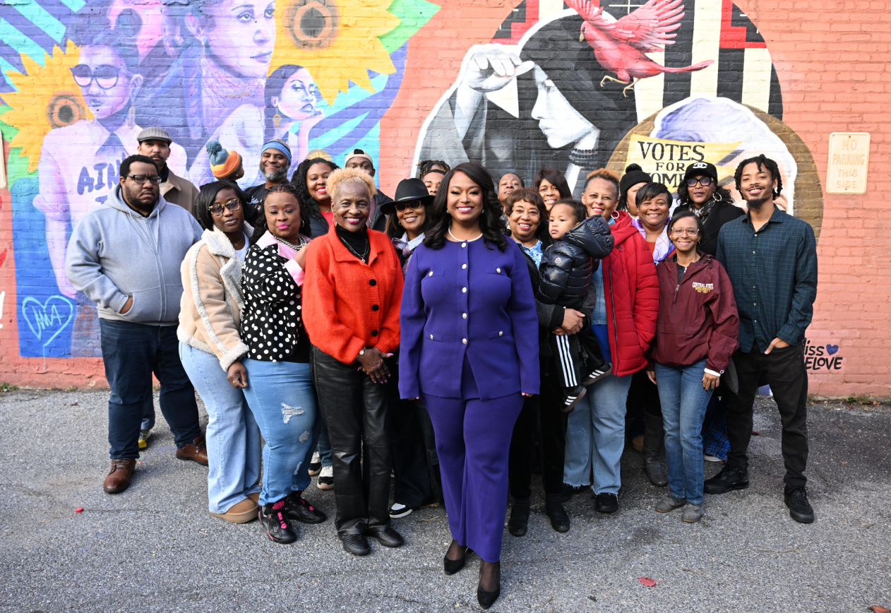 Group in from of mural